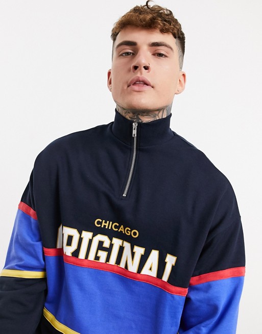ASOS DESIGN oversized half zip sweatshirt with colour block and text print