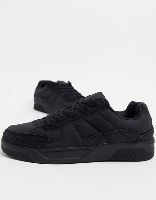 ASOS DESIGN trainers with padded tongue in washed black
