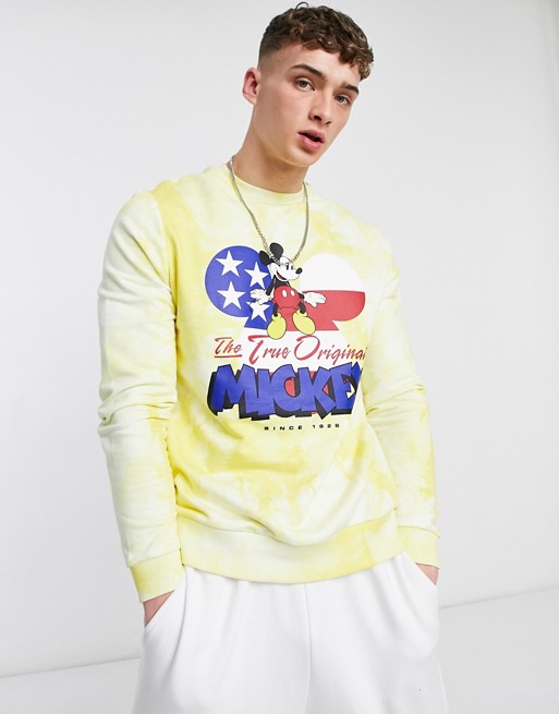 ASOS DESIGN sweatshirt with Disney Mickey Mouse print in tie dye yellow