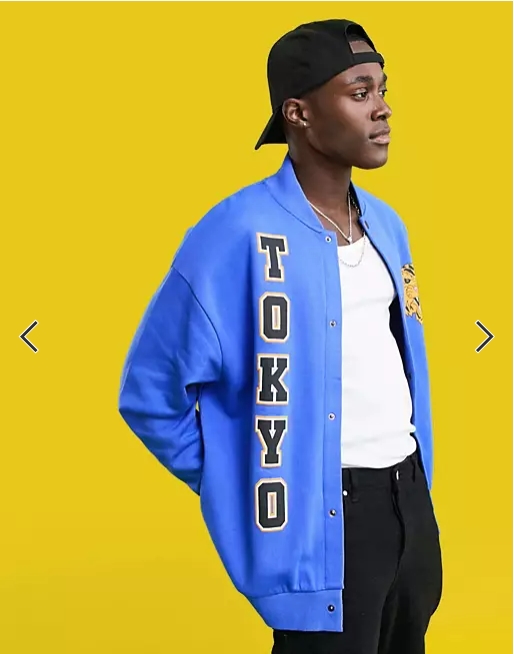 ASOS DESIGN oversized jersey bomber jacket in blue with Tokyo city prints